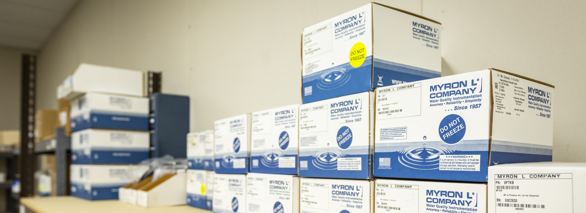 Boxes of Myron L product sitting on a stocking shelf